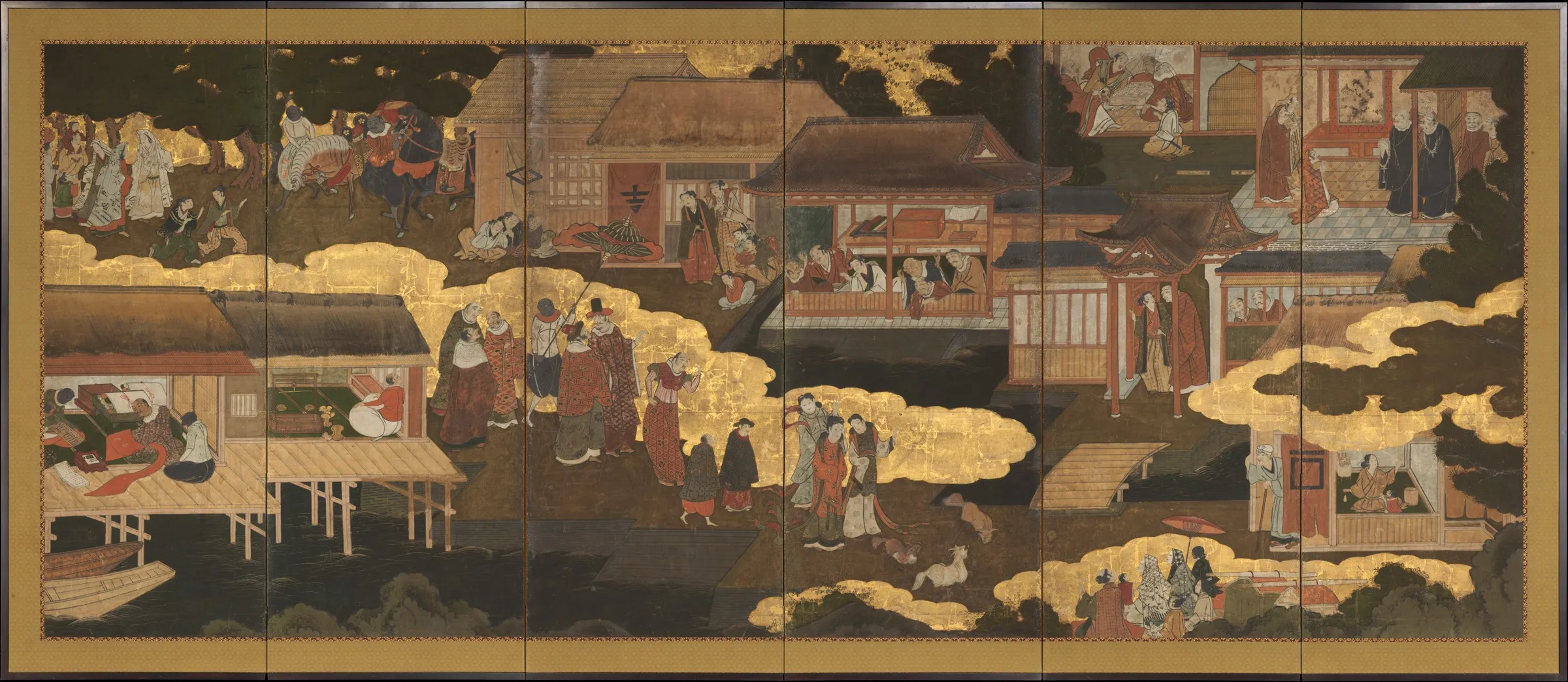 A six-panel Japanese folding screen in gold and dark colours showing European traders, attendants, horses, townspeople, and missionaries moving through a port settlement.