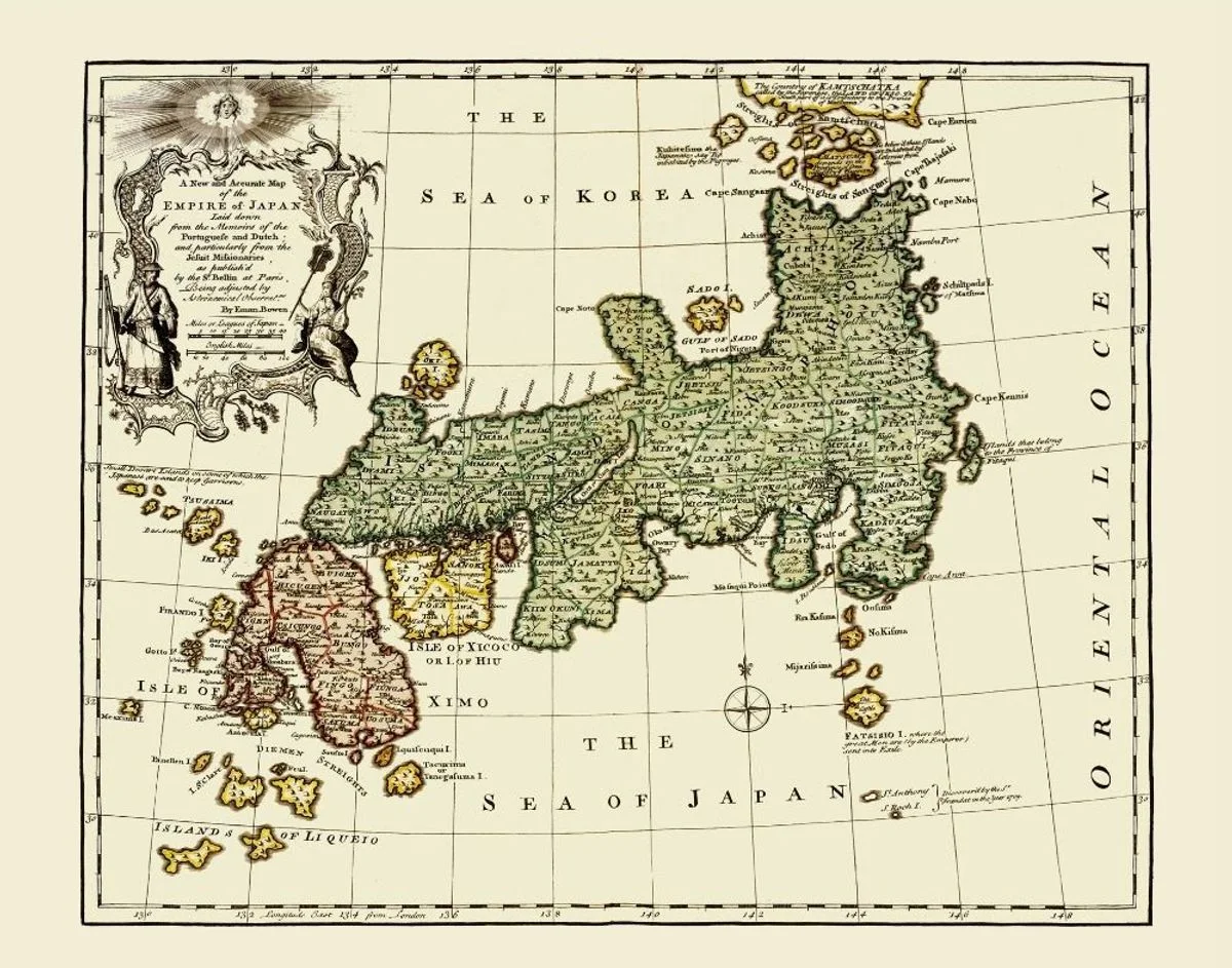 An engraved 1752 map of Japan by Emanuel Bowen, showing the islands, surrounding seas, place names, and a decorative title cartouche.