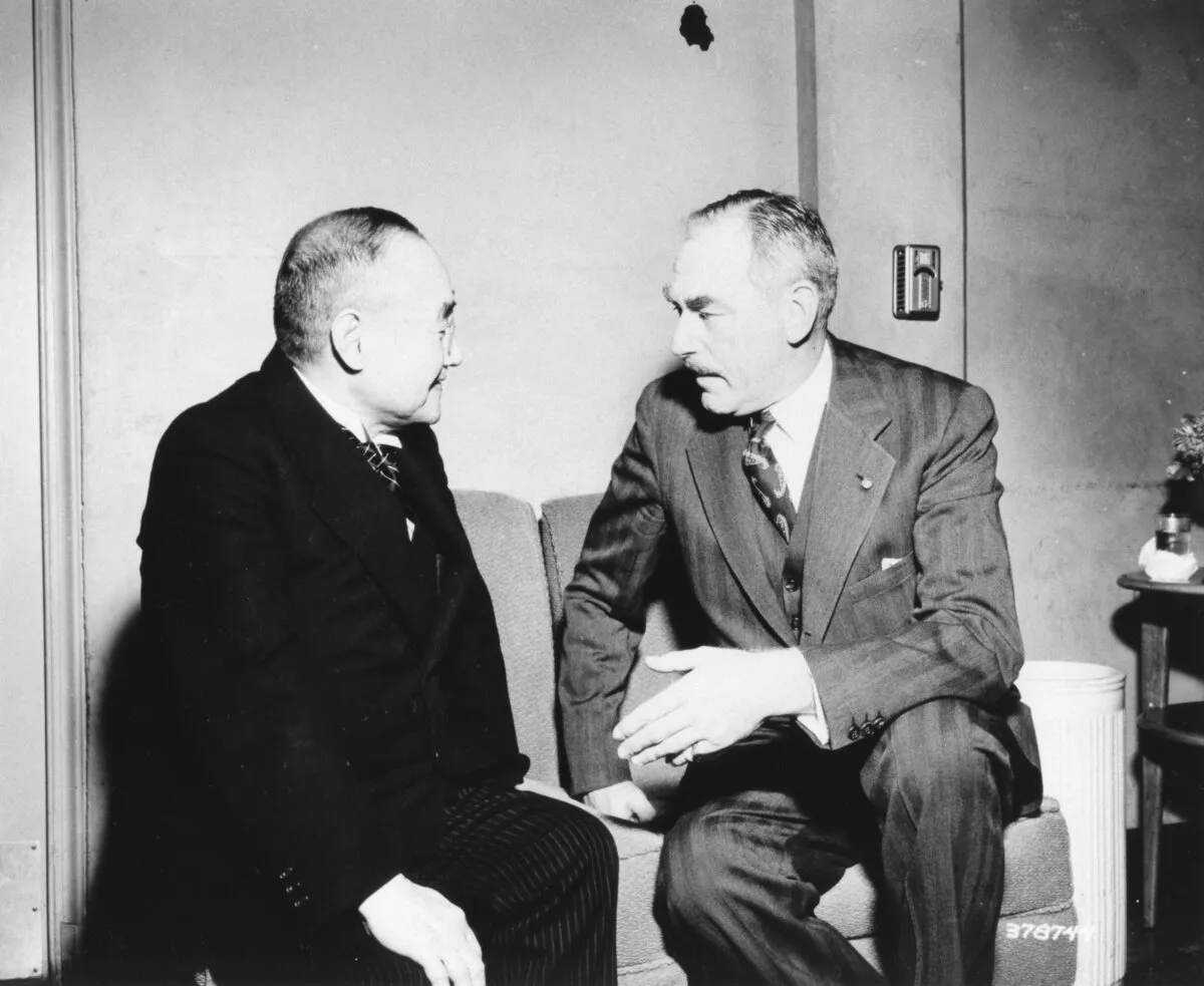 Japanese prime minister Shigeru Yoshida sits closely beside U.S. secretary of state Dean Acheson as they speak after the 1951 security treaty signing in San Francisco.
